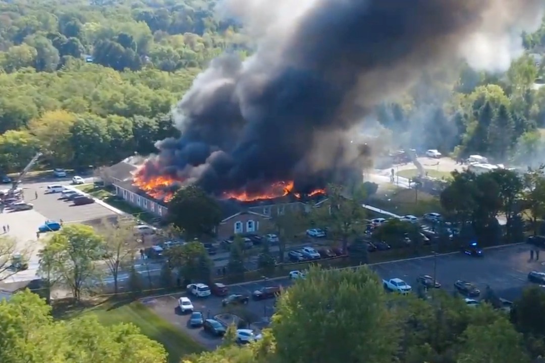 Massive flames and smoke rise from the church of jesus christ of latter-day saints in grand blanc, michigan