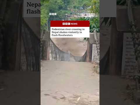 Pedestrian river crossing in Nepal shakes violently in flash floodwaters. #BBCNews 2026