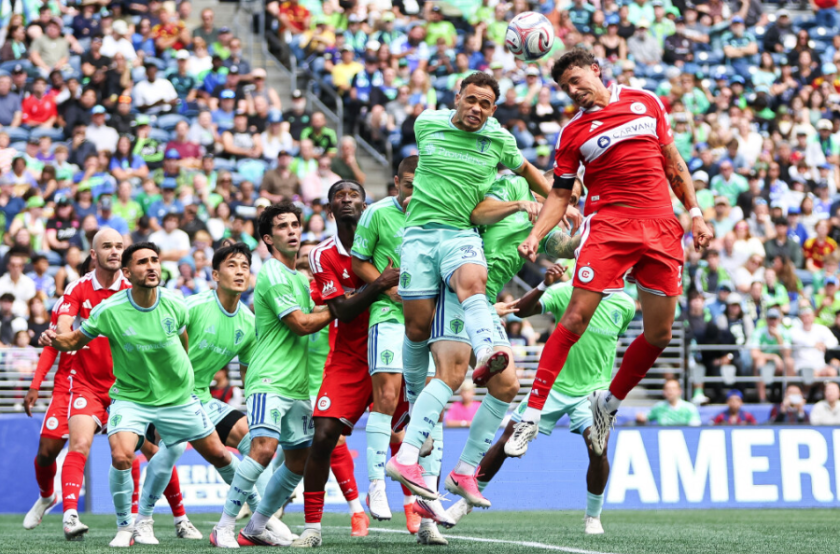 Hassani dotson #31 of the seattle sounders and sam rogers #5 of the fire jump to head the ball during the second half at lumen field on august 29, 2026 in seattle.