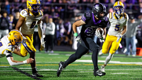 Downers grove north beats lyons to clinch a share of the west suburban silver title 2026 - justice Downers grove north's grant georgas (22) carries the ball for a touchdown against lyons.