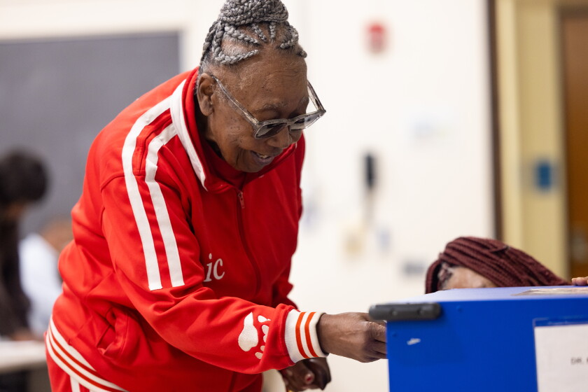 Early voting kicks off in all 50 wards 2026 - justice A woman votes monday at the dr. Martin luther king jr. Community service center polling site in bronzeville.