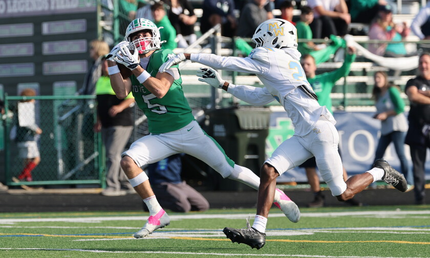 Eric couper to peter panagiotopolous connection sets records, drives notre dame deeper into the 6a playoffs 2026 - justice Notre dame's peter panagiotopoulos (5) catches a pass and scores his second touchdown in the first half against maine west.