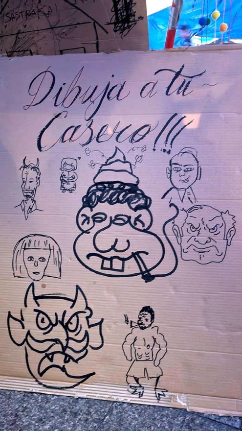Un cartel colaborativo para dibujar a tu casero, visto en la acampada de sol