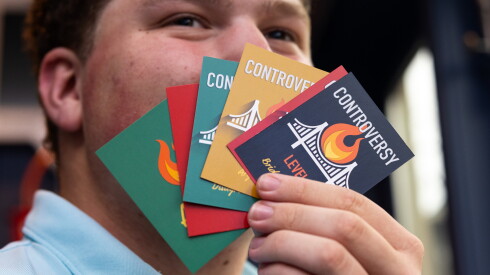 How we photographed the new baby penguins at brookfield zoo 2026 - justice Jordan abell poses with his game, "controversy: turn fights into friends. "