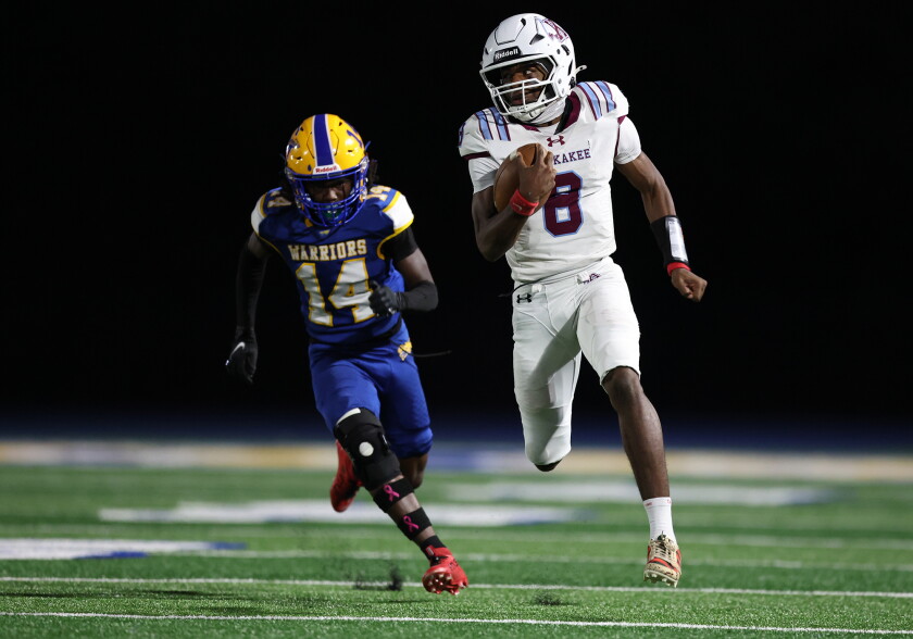 Kankakee's Phillip Turner (8) breaks loose for a long touchdown run against Crete-Monee.