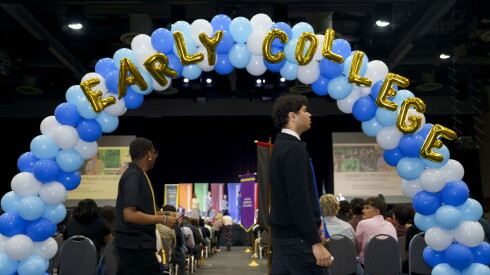 Students walk to their seats during an early college milestone celebration for Chicago Public Schools students, who earned credits or associate degrees through dual credit and dual enrollment early college courses, at the University of Illinois Chicago Isadore and Sadie Dorin Forum in Little Italy, Tuesday, May 19, 2026.