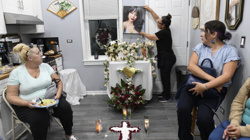 Paola judith zamora rojas' mother, sandra zamora, places her daughter’s portrait on the wall during a prayer vigil for her daughter on friday, oct. 2, 2026. Zamora rojas died by suicide in september 2026.
