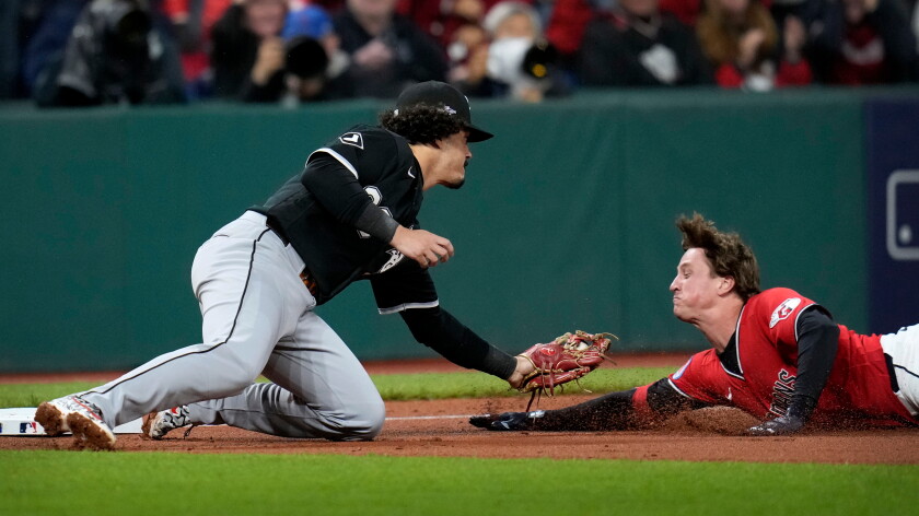 White Sox third baseman Miguel Vargas tags out the Guardians' Petey Halpin on Saturday night in Cleveland.